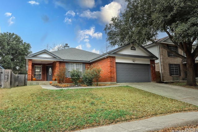 view of front of property featuring a garage and a front lawn