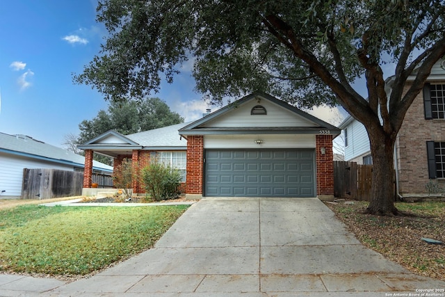 ranch-style house featuring a garage and a front yard