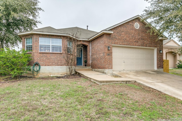 view of front of home with a garage and a front yard