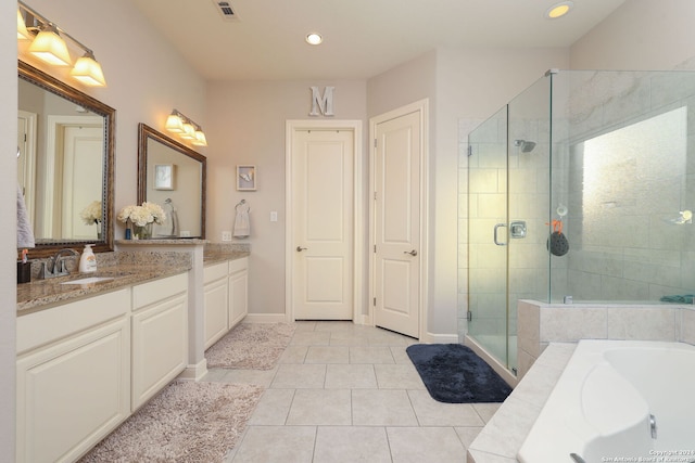 bathroom with vanity, tile patterned flooring, and independent shower and bath