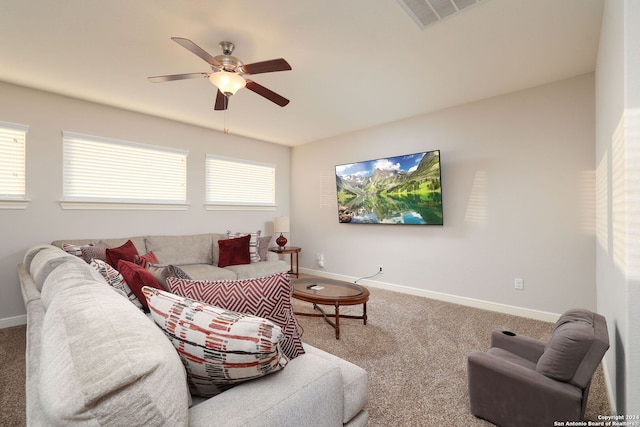 carpeted living room with ceiling fan