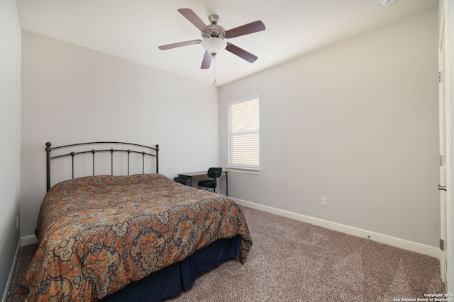 bedroom with ceiling fan and carpet