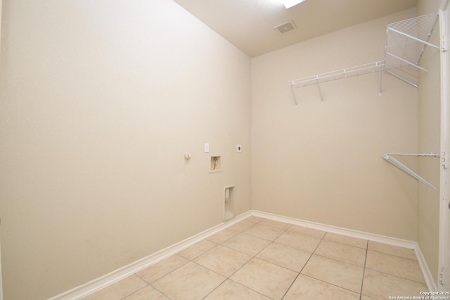 13906 Tahoe Vis, San Antonio, TX 78253 - laundry area with electric dryer hookup, laundry area, light tile patterned floors, visible vents, and hookup for a washing machine