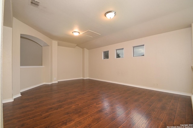 13906 Tahoe Vis, San Antonio, TX 78253 - spare room featuring dark wood-type flooring, baseboards, lofted ceiling, and visible vents