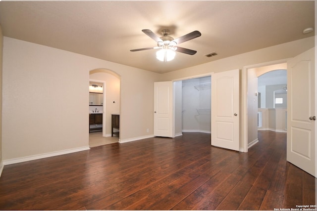 13906 Tahoe Vis, San Antonio, TX 78253 - unfurnished room with dark wood finished floors, a ceiling fan, arched walkways, and visible vents