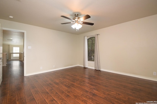 13906 Tahoe Vis, San Antonio, TX 78253 - empty room featuring baseboards, dark wood-style floors, and a ceiling fan