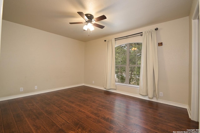 13906 Tahoe Vis, San Antonio, TX 78253 - spare room featuring baseboards, dark wood-style flooring, and a ceiling fan