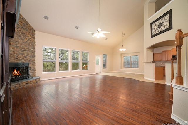 13906 Tahoe Vis, San Antonio, TX 78253 - unfurnished living room with high vaulted ceiling, visible vents, a fireplace, a ceiling fan, and light wood-style floors