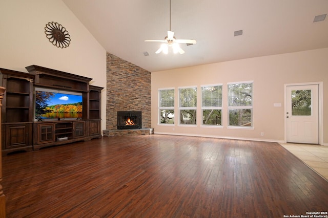 13906 Tahoe Vis, San Antonio, TX 78253 - unfurnished living room with a stone fireplace, visible vents, ceiling fan, and wood-type flooring