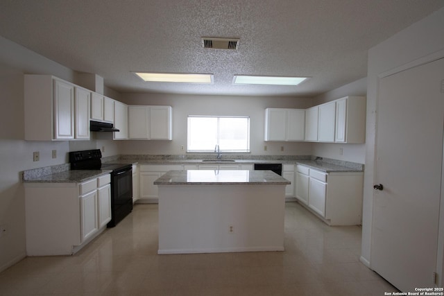 kitchen with sink, white cabinetry, light stone counters, black range with electric cooktop, and a kitchen island