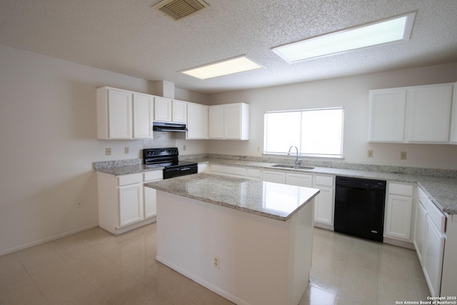 kitchen featuring a kitchen island, sink, white cabinets, black appliances, and light stone countertops