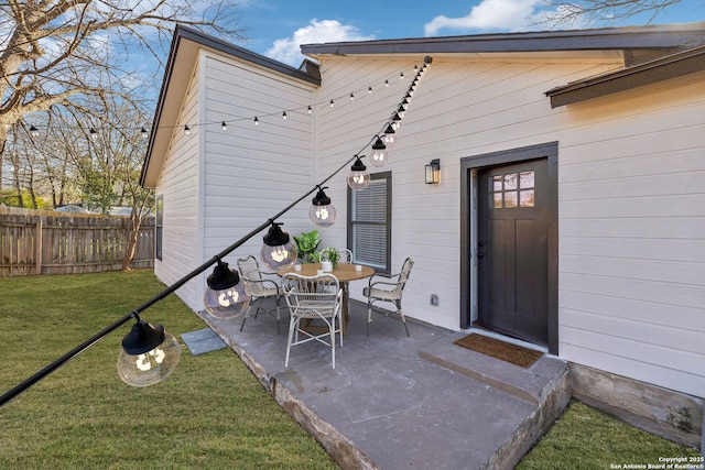 rear view of house featuring a patio area and a lawn