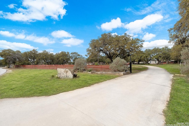 view of property's community with a lawn