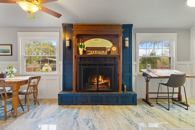 interior space with wood-type flooring and a large fireplace