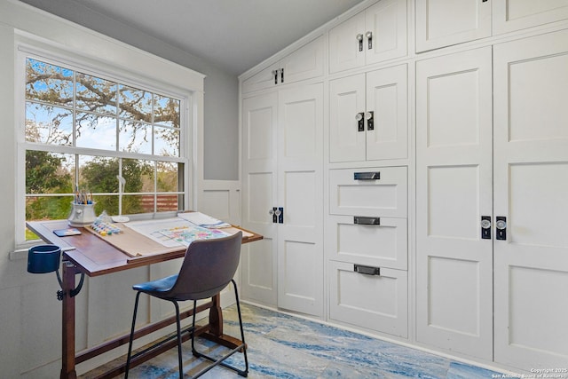 home office with lofted ceiling