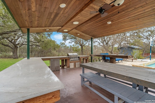 exterior space with ceiling fan and area for grilling