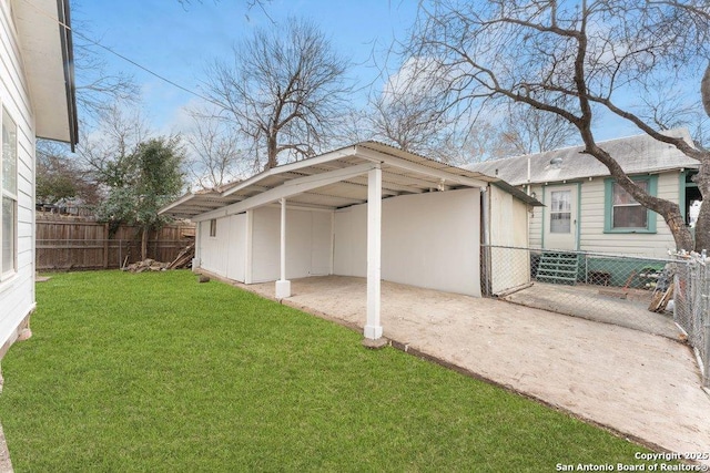 exterior space with a carport