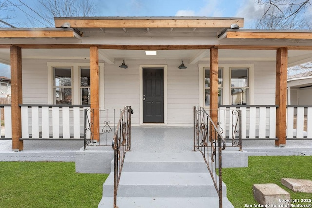 doorway to property with a porch