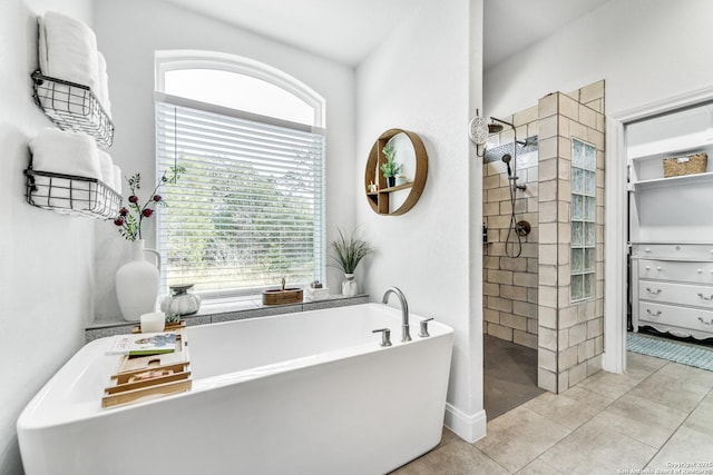 bathroom featuring separate shower and tub and tile patterned flooring