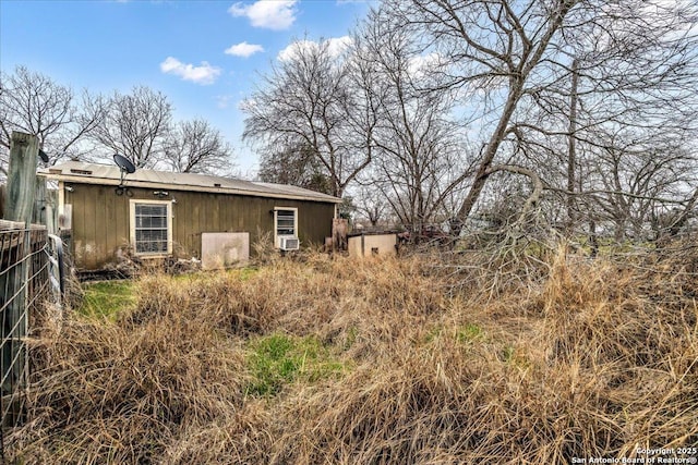 rear view of house with cooling unit