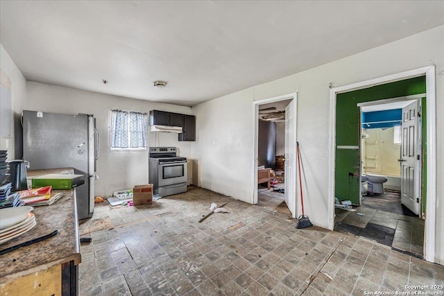 kitchen featuring dark brown cabinets and appliances with stainless steel finishes