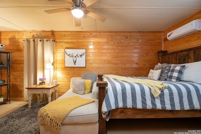 carpeted bedroom featuring ceiling fan, wooden walls, and a wall mounted AC