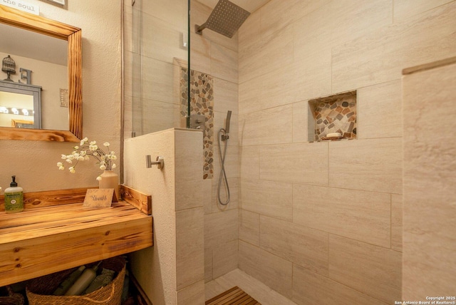 bathroom featuring a tile shower