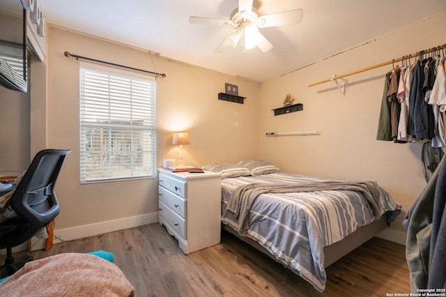 bedroom with ceiling fan and light wood-type flooring