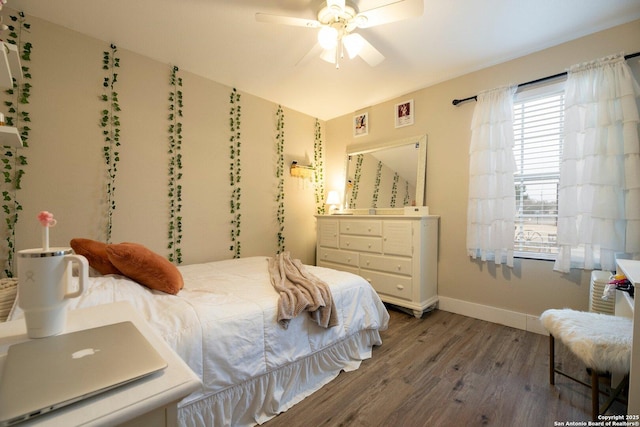 bedroom featuring hardwood / wood-style flooring and ceiling fan