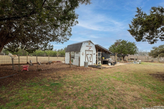 exterior space featuring an outdoor structure and a rural view