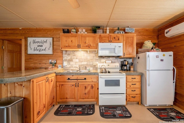 kitchen featuring a wall mounted air conditioner, wooden walls, a paneled ceiling, and white appliances