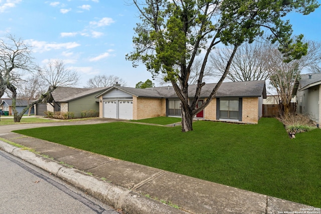 single story home with a garage and a front yard