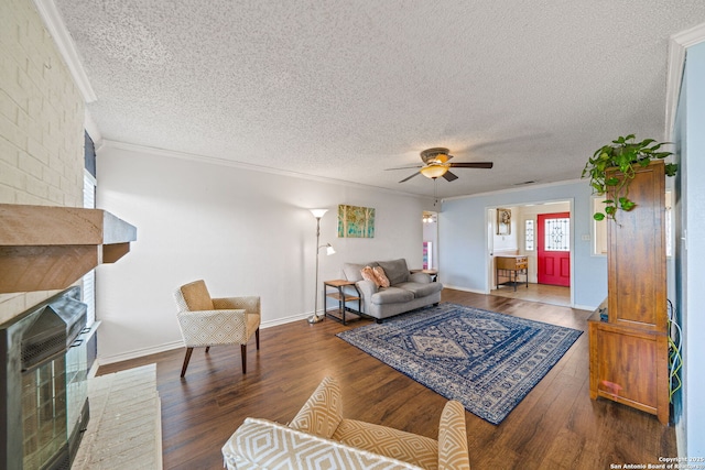 living room with hardwood / wood-style flooring, ornamental molding, and heating unit