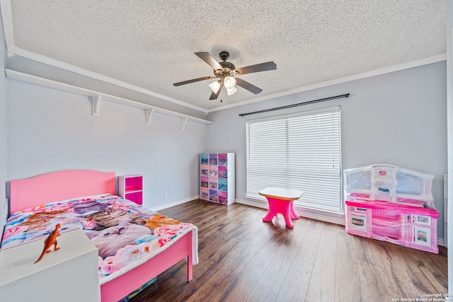 bedroom with crown molding, ceiling fan, a textured ceiling, and dark hardwood / wood-style flooring