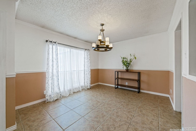 spare room with light tile patterned flooring, a textured ceiling, and a notable chandelier