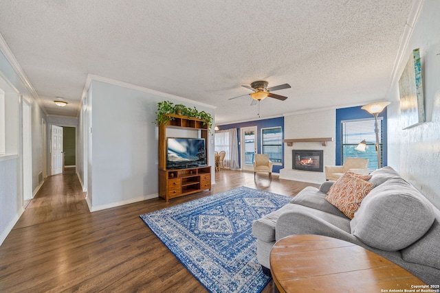 living room featuring crown molding, dark hardwood / wood-style floors, and a textured ceiling