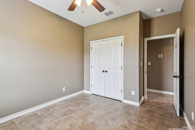 unfurnished bedroom with a closet and ceiling fan