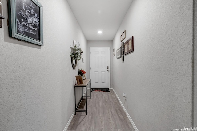 corridor featuring hardwood / wood-style flooring