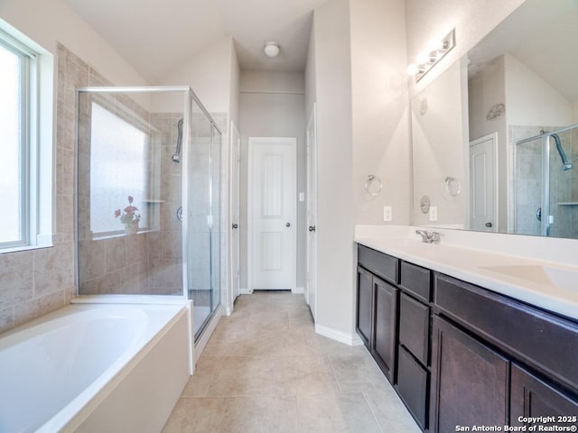 bathroom featuring vanity, tile patterned floors, and separate shower and tub