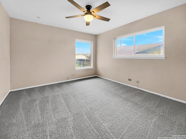 carpeted empty room featuring ceiling fan