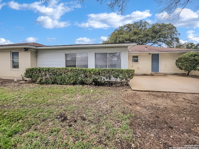 back of property with a patio