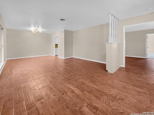 spare room with hardwood / wood-style floors