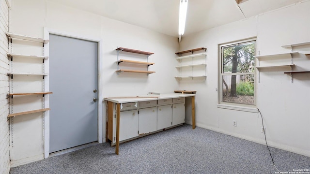 kitchen featuring light carpet