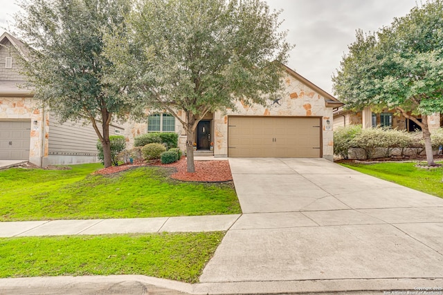 obstructed view of property with a garage and a front yard