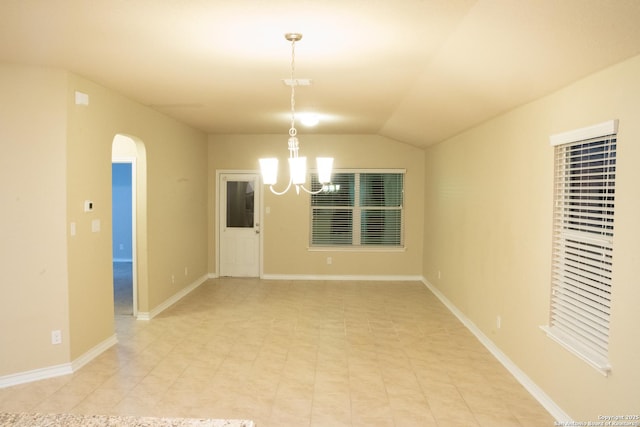 unfurnished room with vaulted ceiling and a chandelier