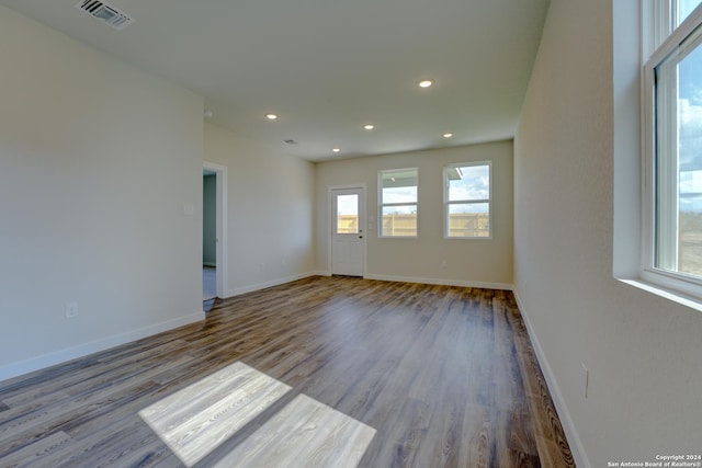 empty room with light hardwood / wood-style floors