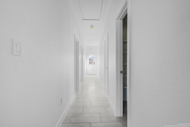 corridor with light tile patterned floors