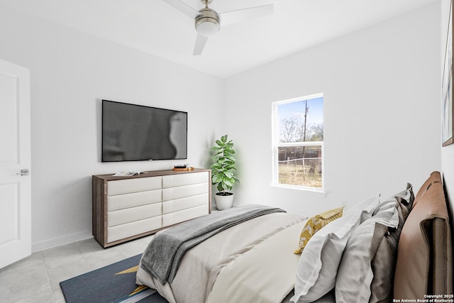 bedroom featuring ceiling fan and light tile patterned flooring