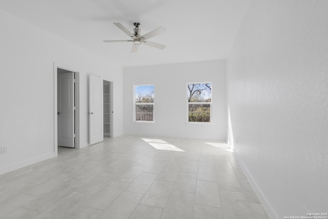 unfurnished bedroom featuring ceiling fan