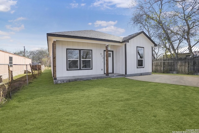 exterior space featuring a patio area and a front lawn